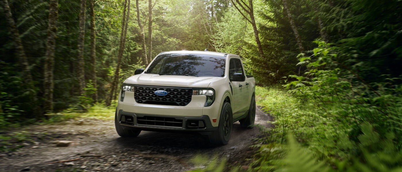 2026 Ford Maverick driving in the forest