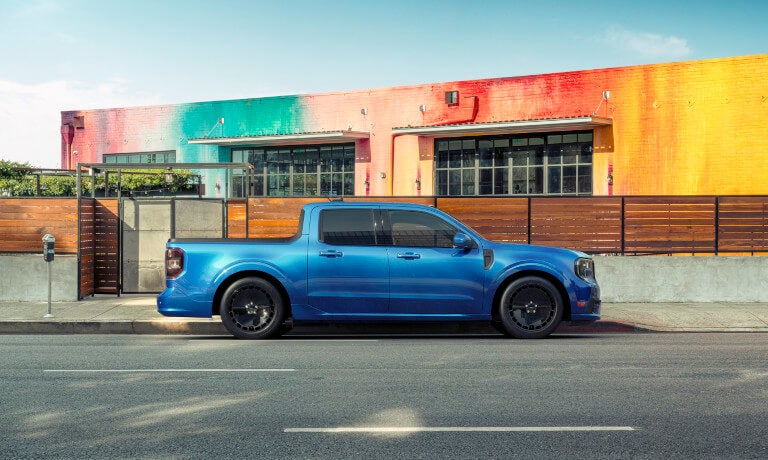 2026 Ford Maverick side view by colorful wall