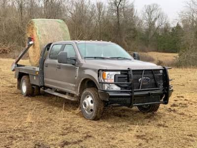 Grille guard on Front Bumper is displayed on ford vehicle containing grass role.